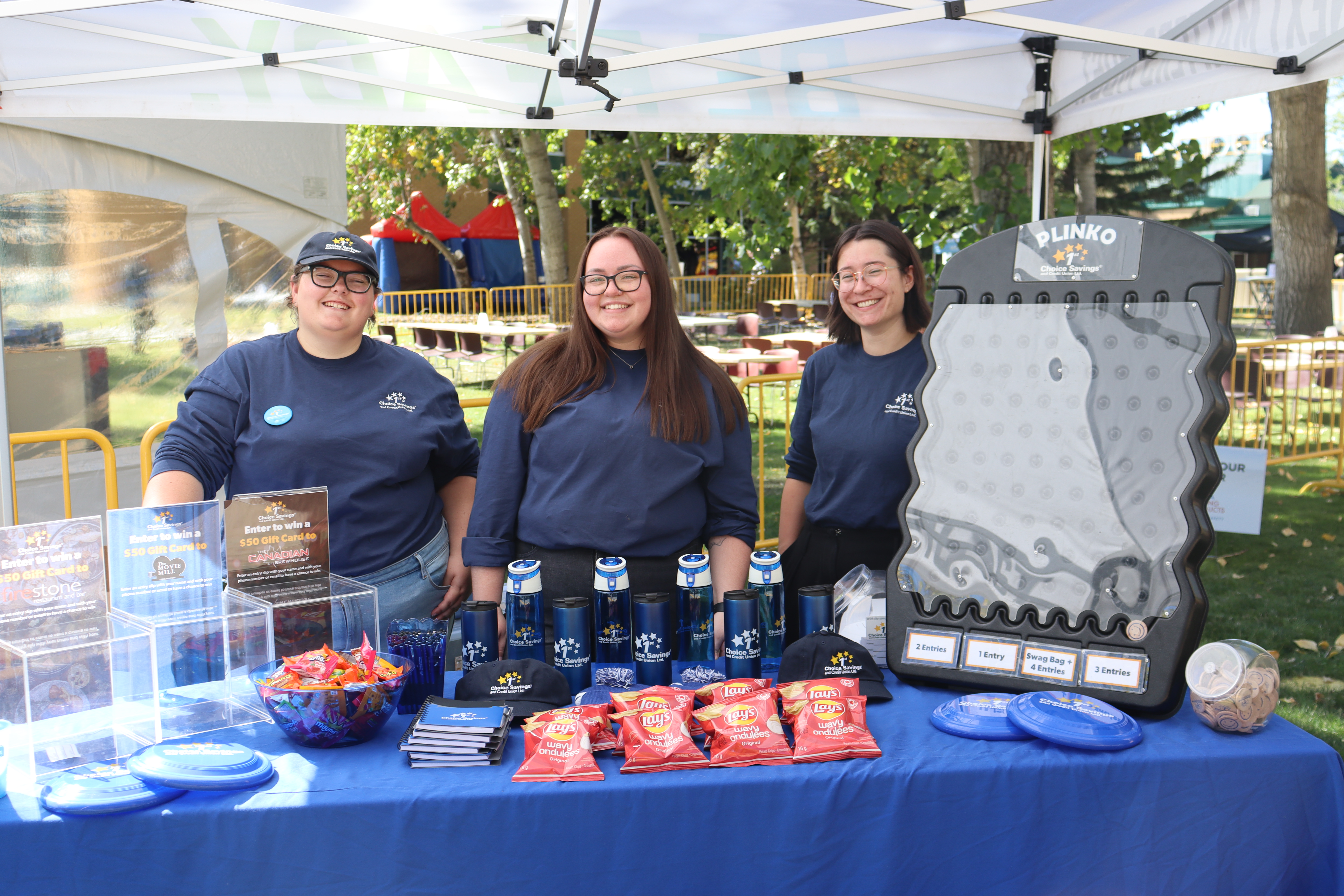 marketing team standing at booth