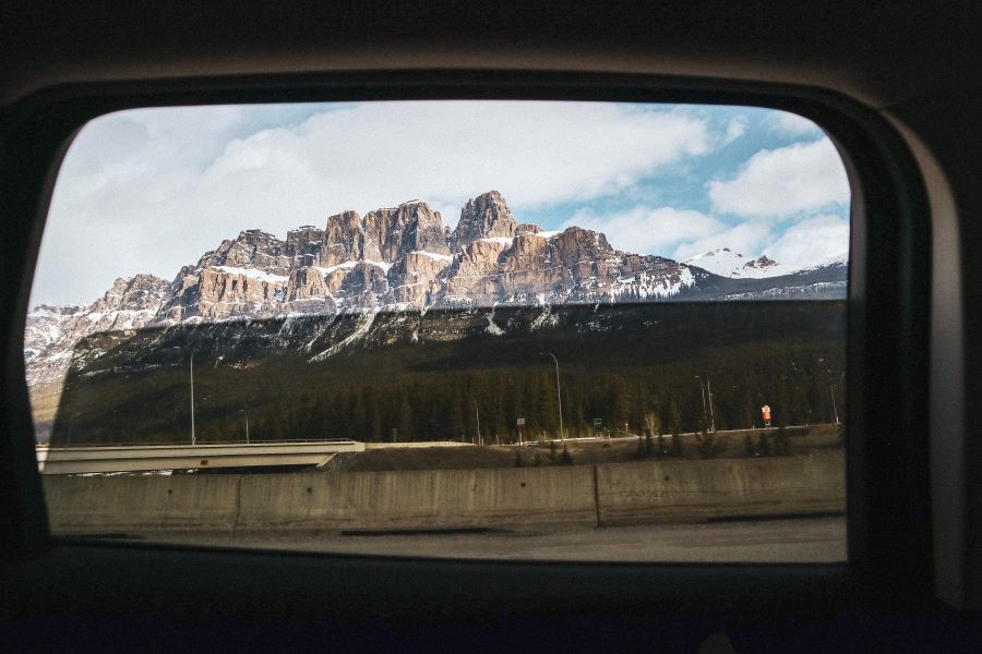 view of mountains through a car window